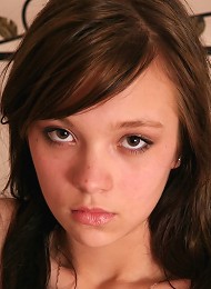 Innocent looking brunette teen poses naked for the first time