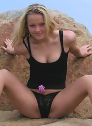 blonde teen on tip toes outside